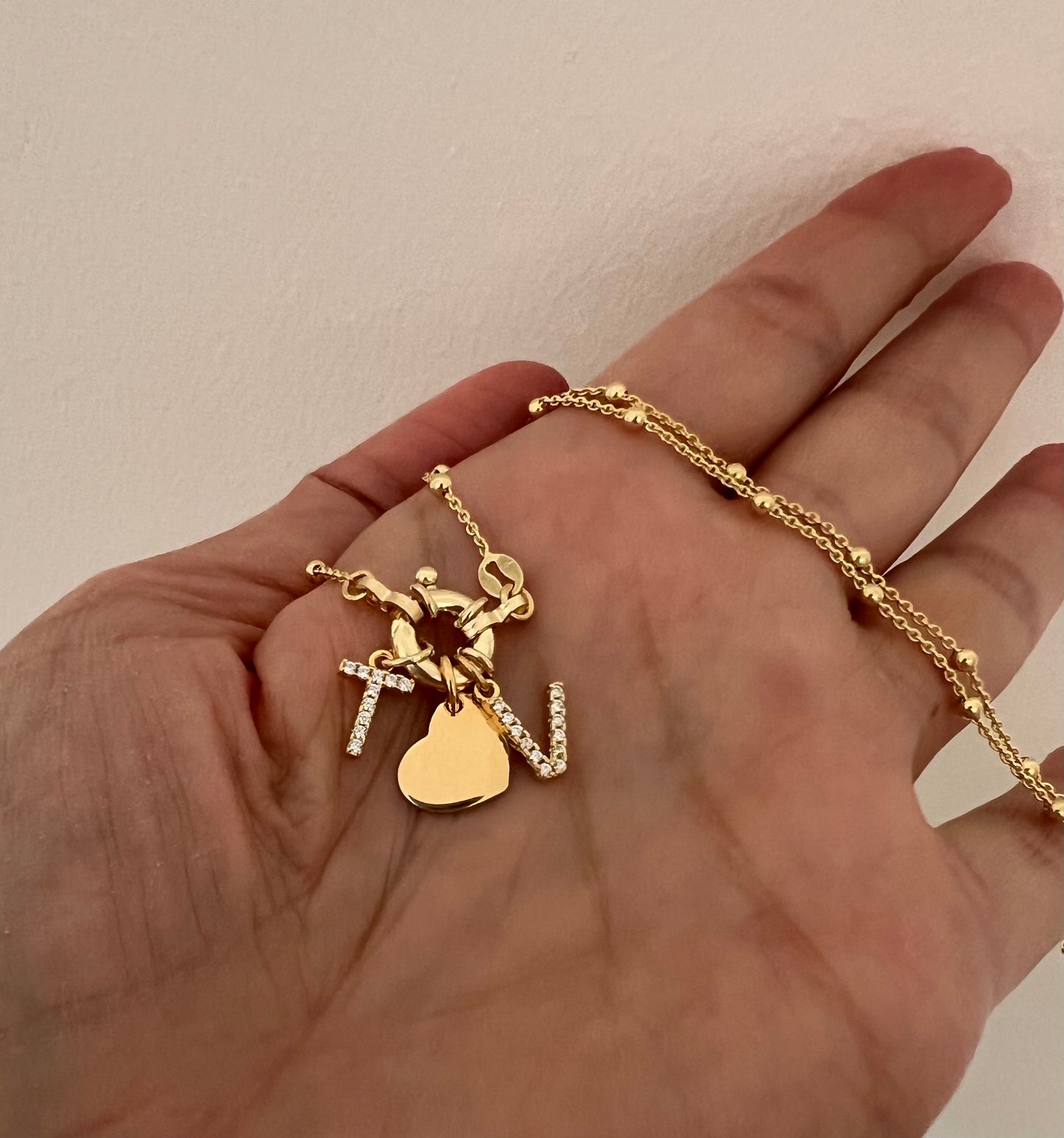 Collana con chiusura a timone e charms