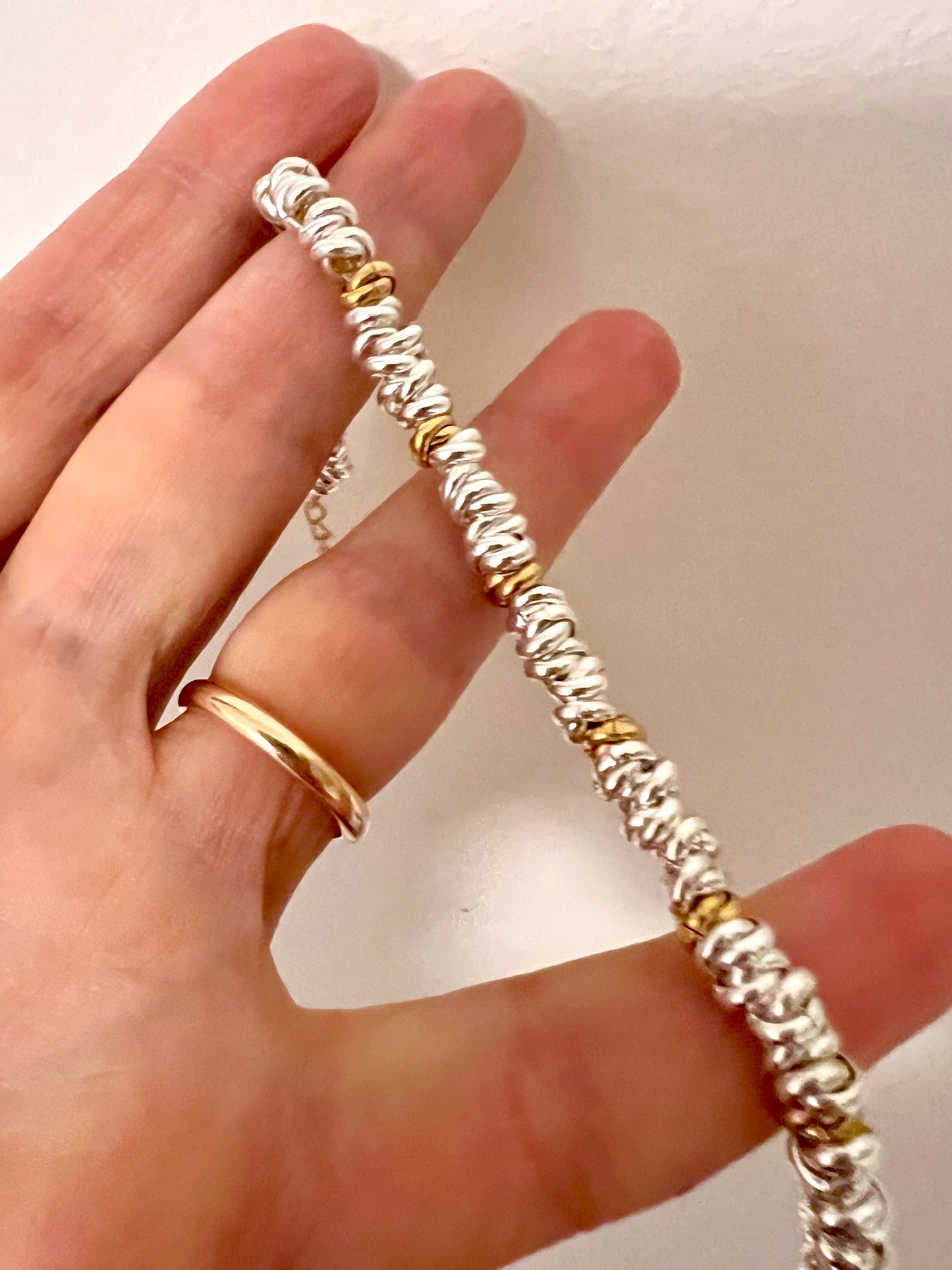 Bracciale in acciaio argentato e dorato