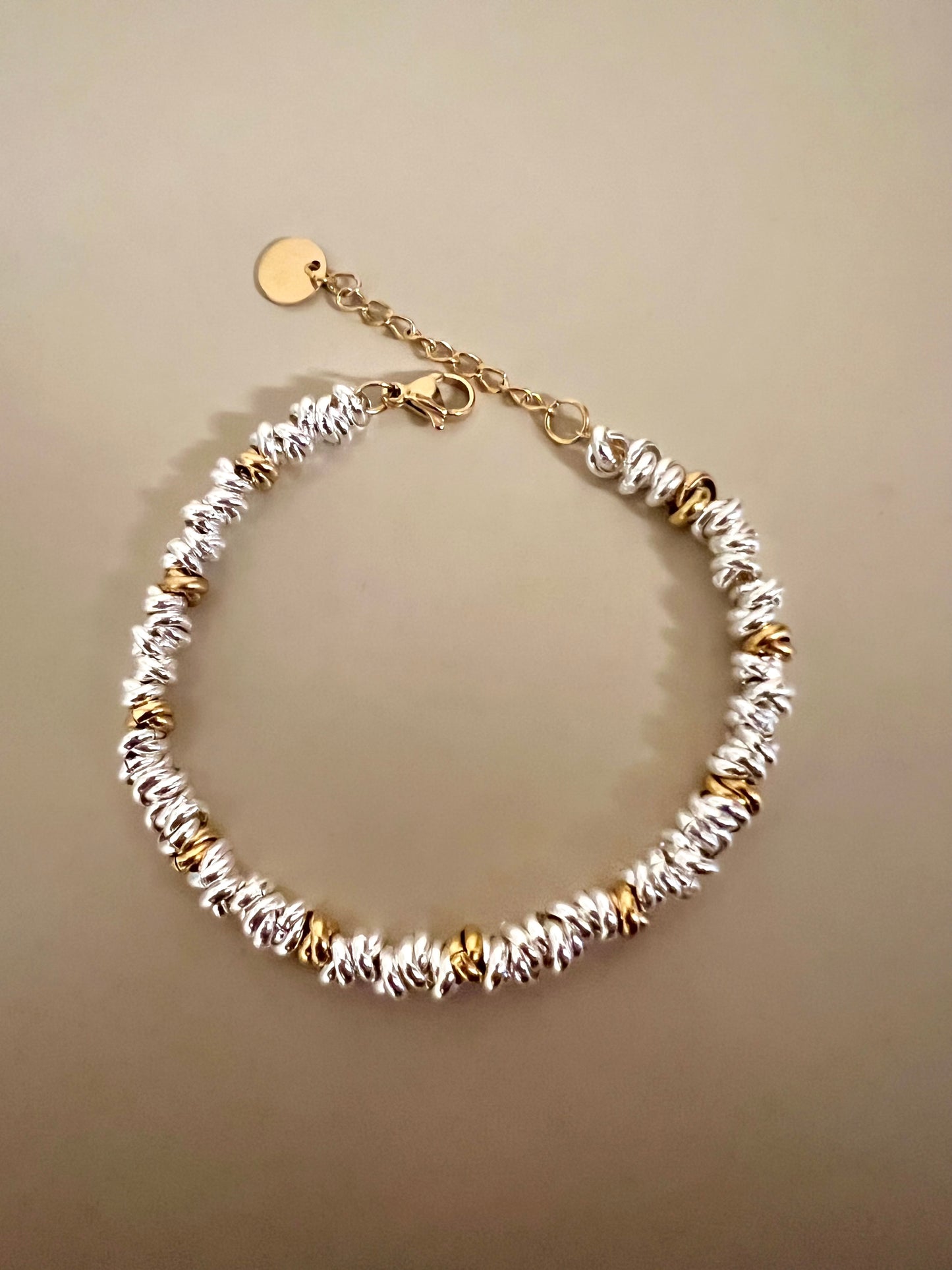 Bracciale in acciaio argentato e dorato