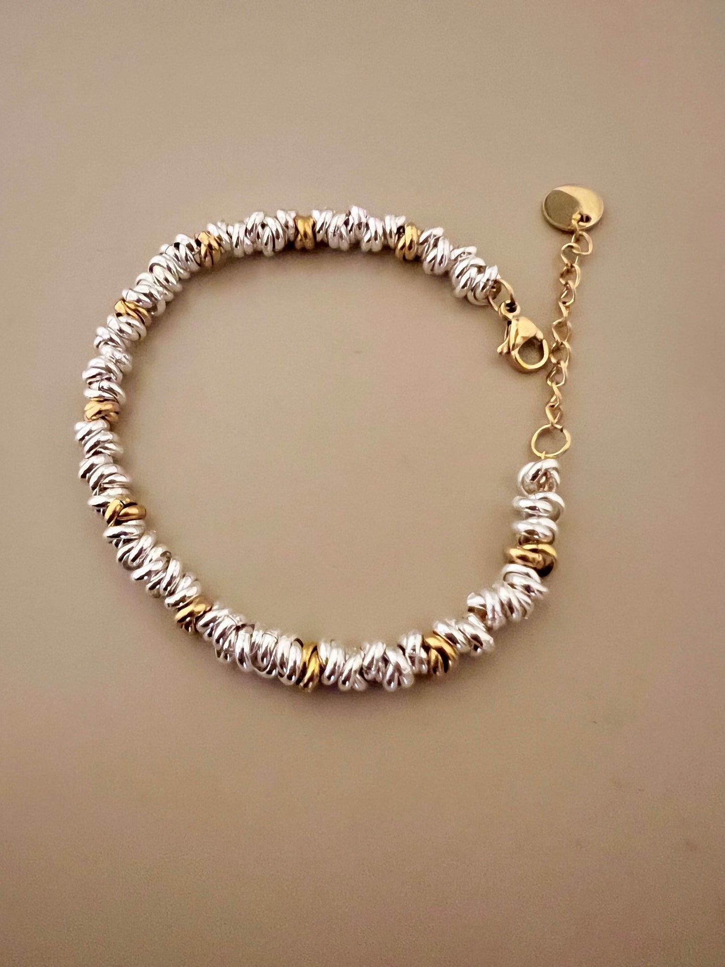 Bracciale in acciaio argentato e dorato