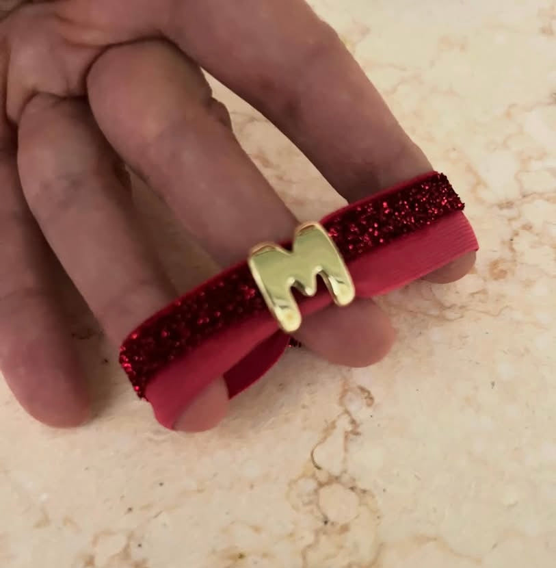 Bracciali a fascia glitter con iniziale baloon