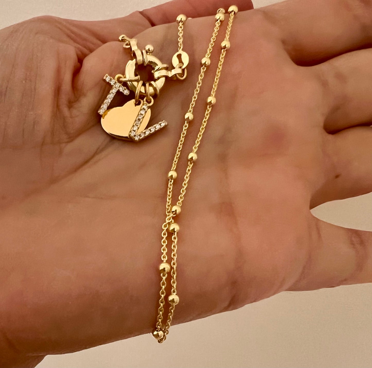 Collana con chiusura a timone e charms