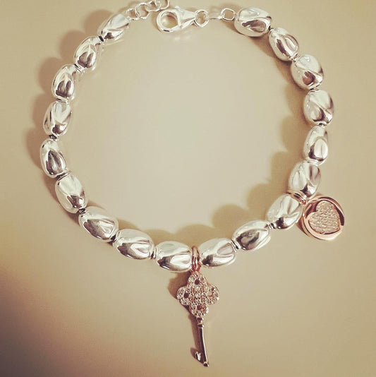 Bracciale con ciondoli cuore e chiave