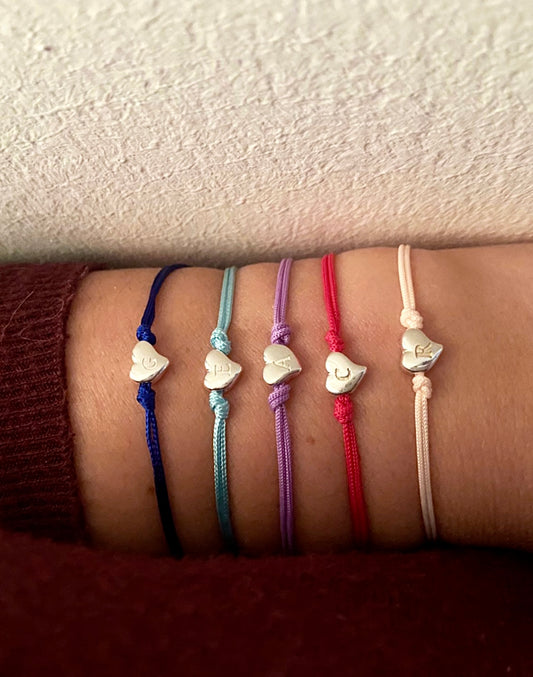 Bracciali cordino colorato e cuoricino iniziale